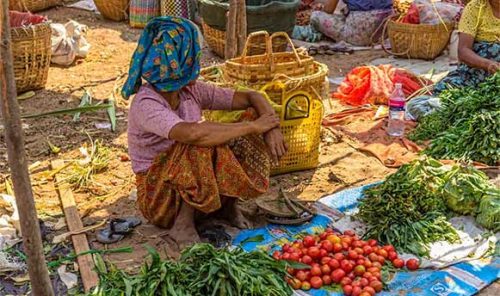 Woman selling vegetables at the local market