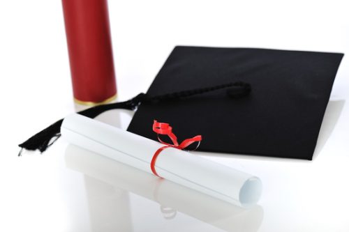 Diploma and graduating cap