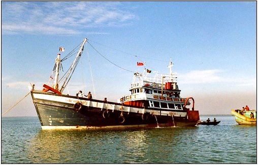 Plate 2: Burmese ship flying the Bangladesh and the Burmese flags, Naf River. Photograph: Willem van Schendel, 2001